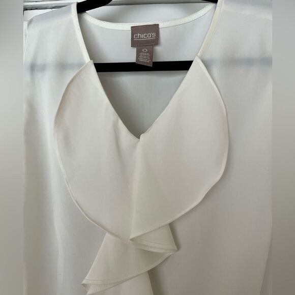 Chico’s white sleeveless v-neck blouse, jabot in front, slits at sides, size 0. - Picture 2 of 7